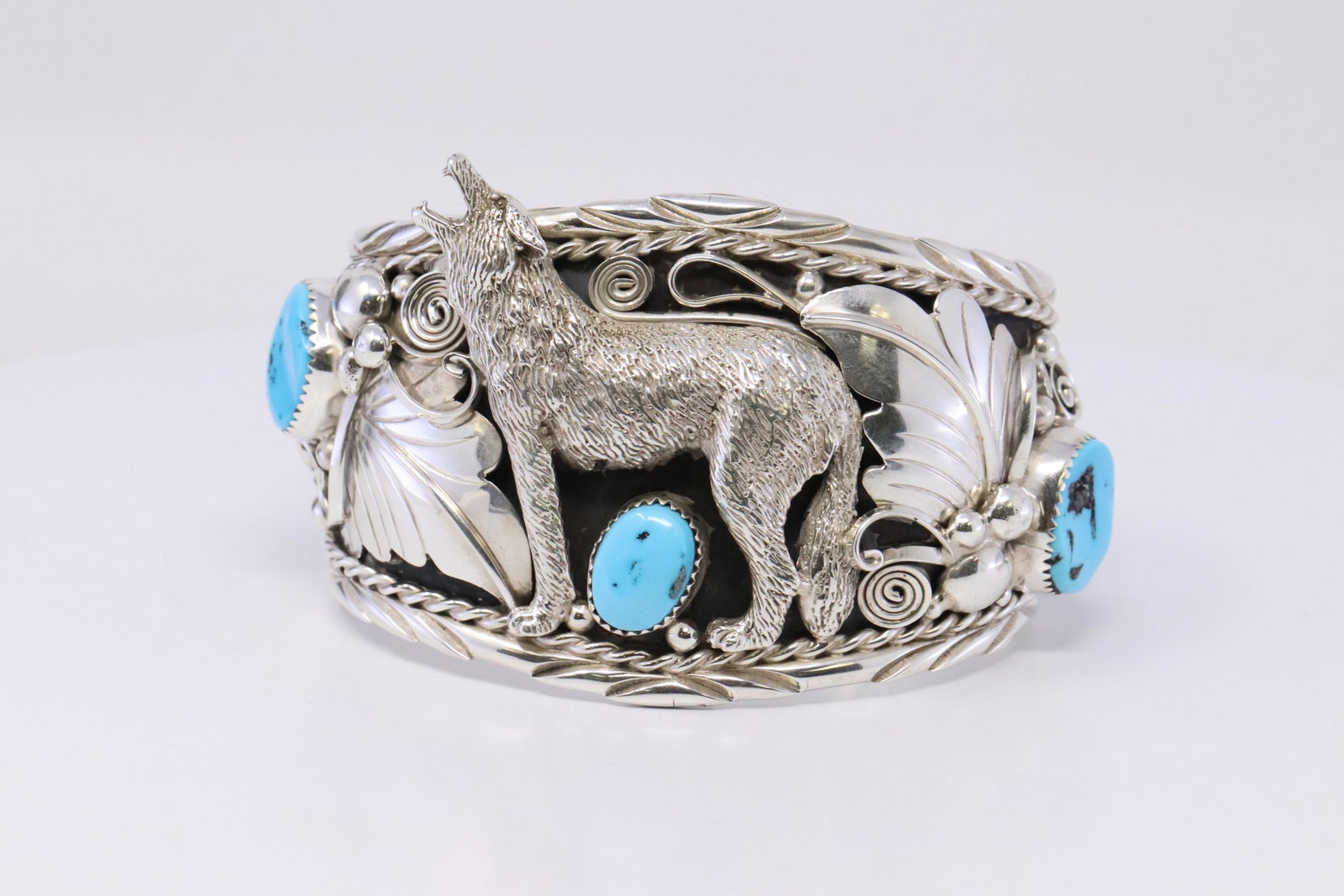 Native American Navajo Handmade Turquoise & Sterling: This is a Native American Navajo Handmade Turquoise & Sterling Silver Howling Coyote Bracelet by Thomas Yazzie. Total weight is 91.00g.