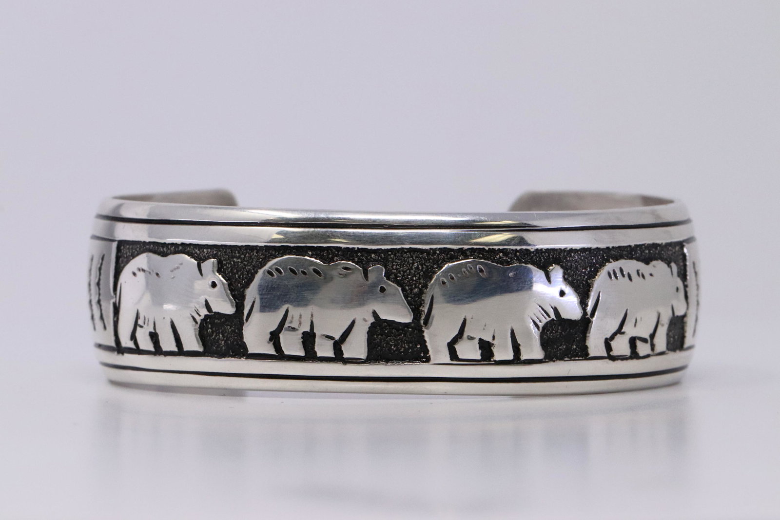 Native American Navajo Handmade Sterling Silver Bear: This is a Native American Navajo Handmade Sterling Silver Bear Bracelet by T&R Singer. Bracelet Maesurement inside is 6.00in