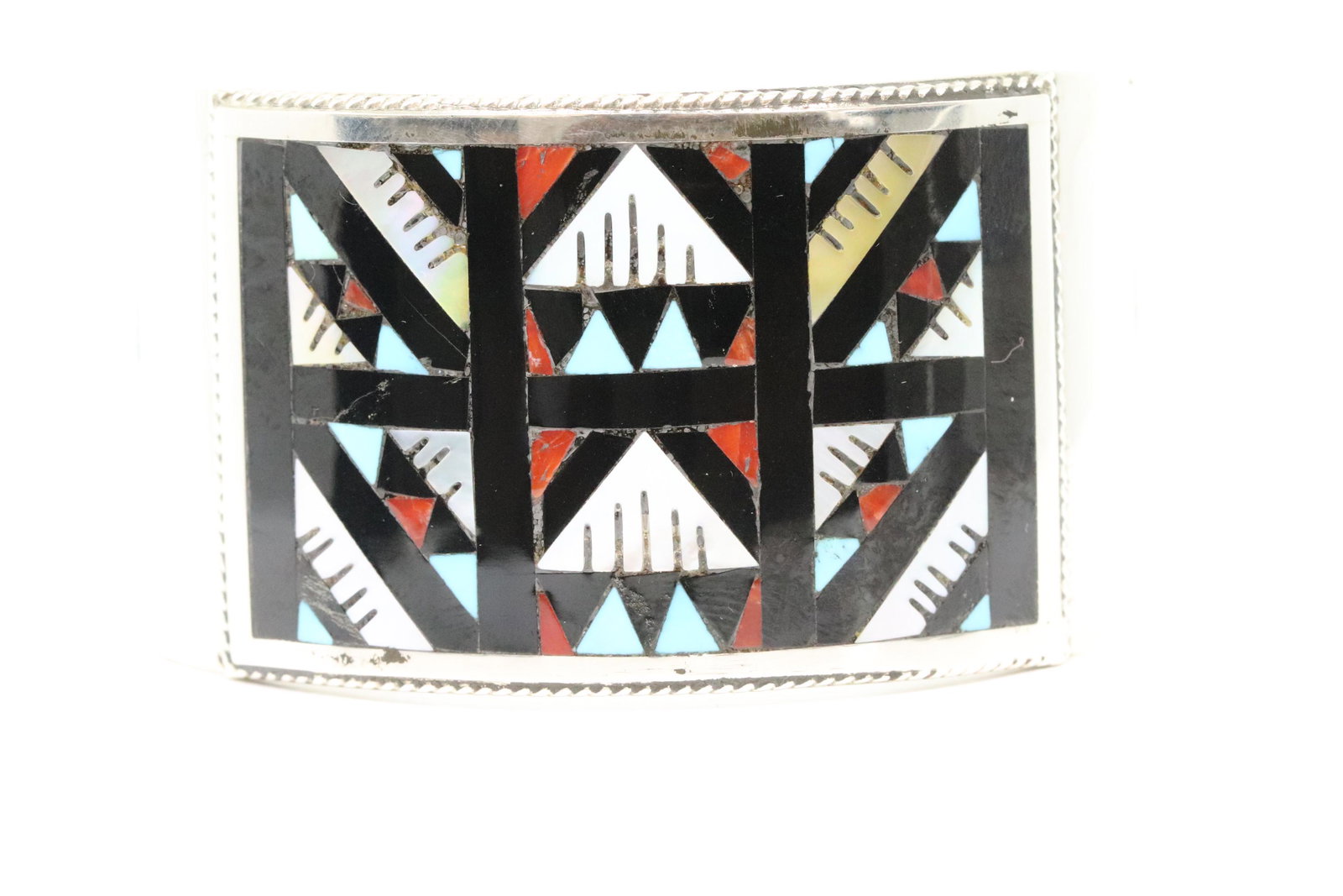 Leander and Lisa Othole Zuni Mosaic Inlay and Sterling: Leander and Lisa Othole Zuni Mosaic Inlay and Sterling Silver Handmade Bracelet. Size dimensions are 5 3/4" inside the cuff, and 1" across the opening gap for a total of 6 3/4" around