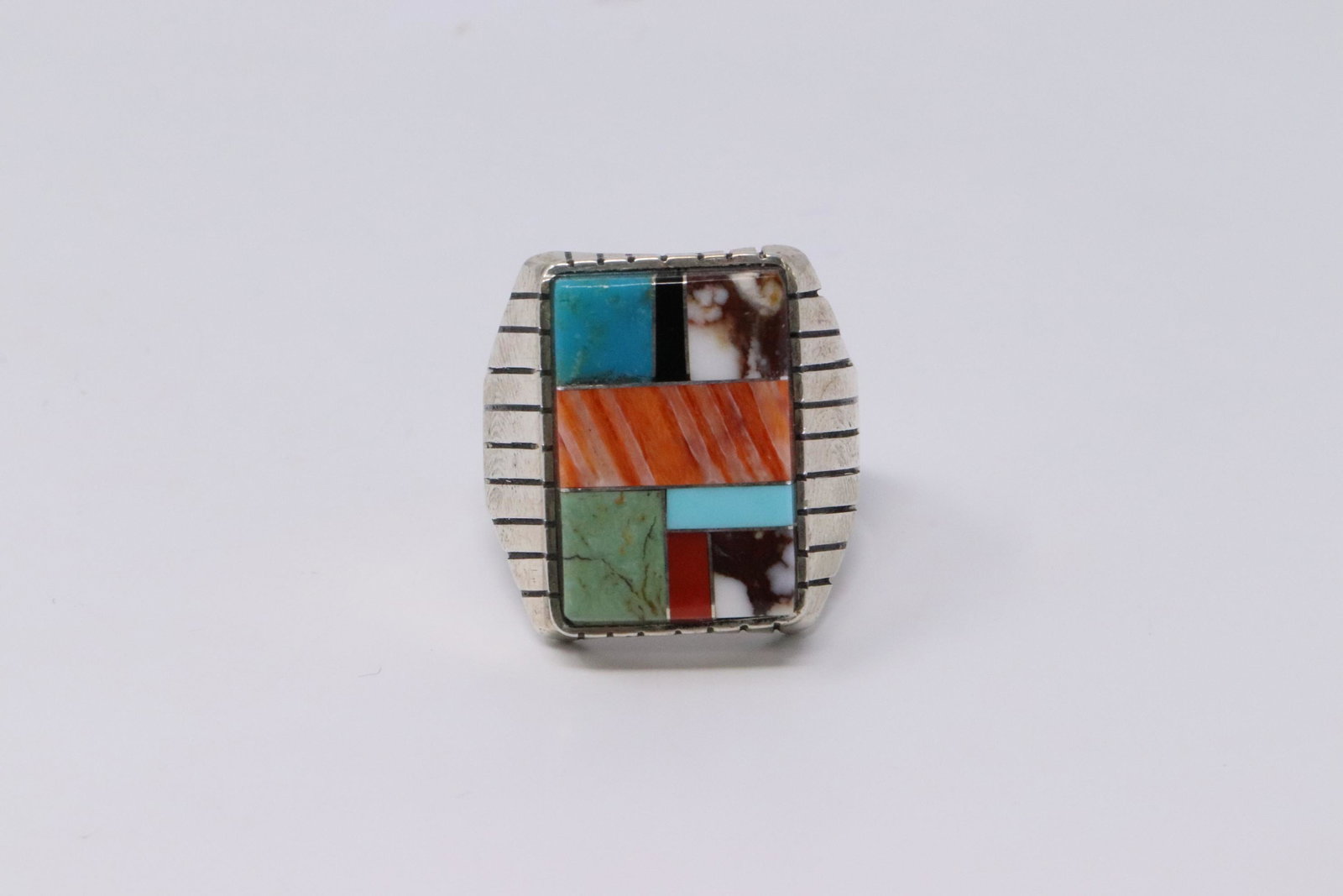 Native American Navajo Handmade Sterling Silver: This is a Native American Navajo Handmade Sterling Silver Multi-Color Inlay Ring by Ray Jack. Ring size is 12.50