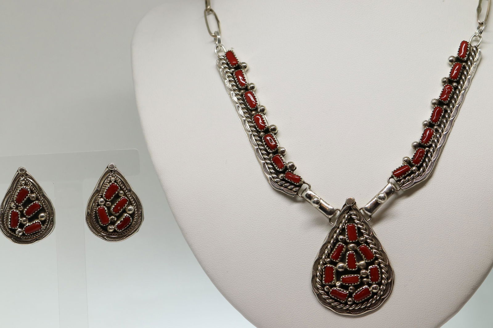 Darlene Begay Mediterranean Coral Necklace & Earrings: Darlene Begay Mediterranean Coral Necklace & Earrings Cluster Set handmade. Metal: Sterling Silver. Necklace length: 22.00in end to end. Earrings length: 1.50in.