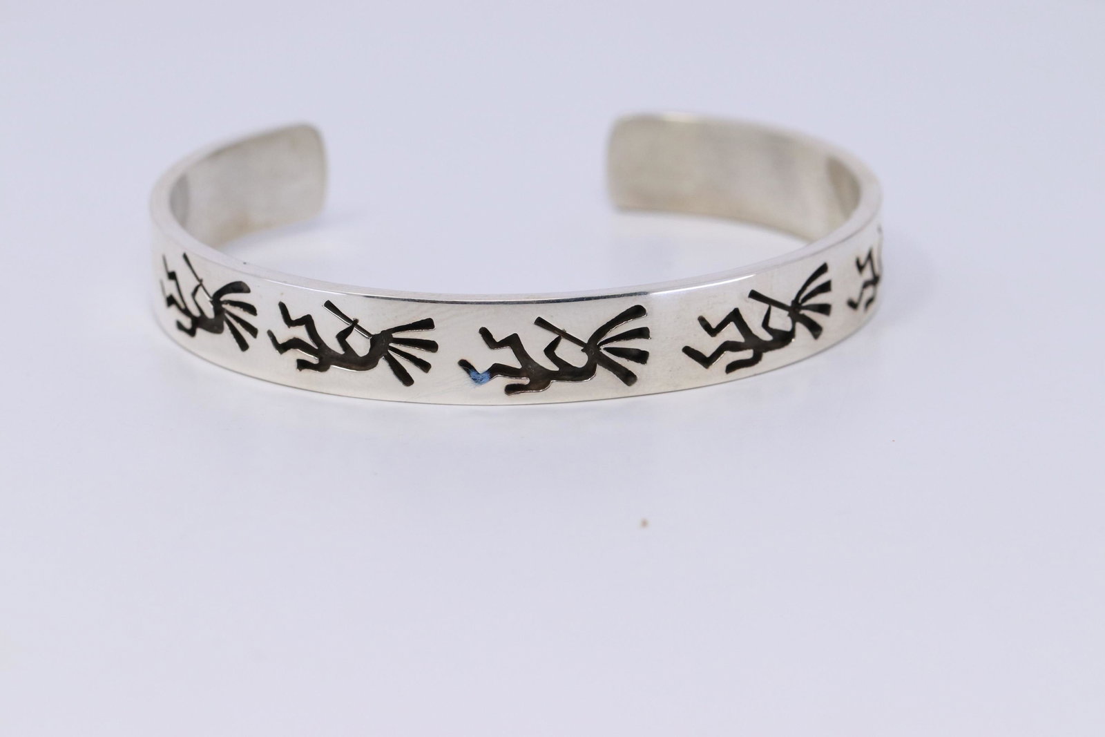 Native American Navajo Handmade Sterling Silver Stamped: This is a Navajo Hand Stamped Sterling Silver Bracelet by Calvin Peterson.