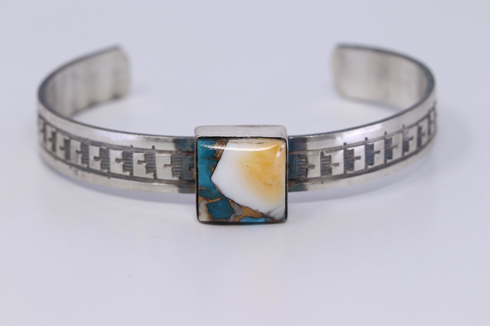 Native American Navajo Handmade Multi-Color Bracelet By: This is a Native American Navajo Handmade Multi-Color Bracelet By Rick Inriquez.