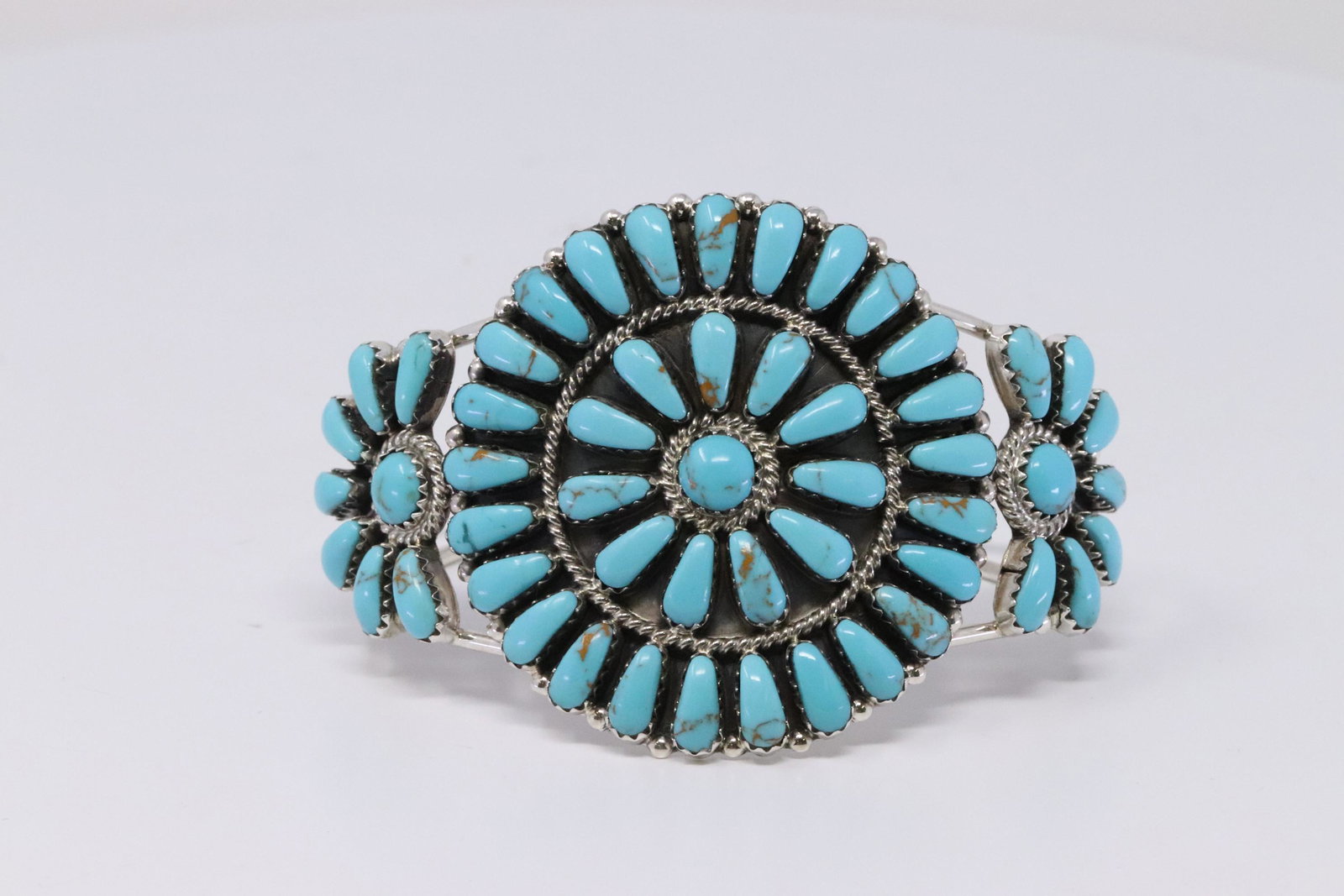 Native American Navajo Handmade Sterling Silver: This is a Native American Navajo Handmade Sterling Silver Turquoise Cluster Bracelet by Devin Benally.