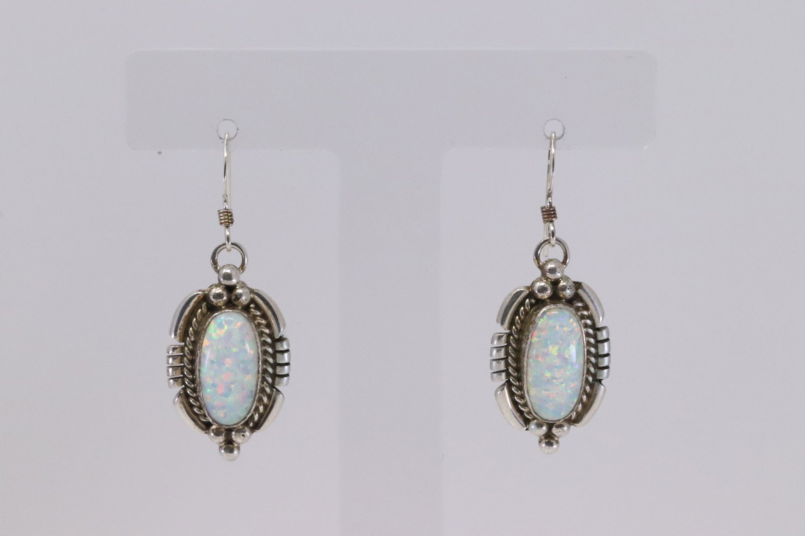 Native American Navajo Handmade Sterling Silver: This is a Native American Navajo Handmade Sterling Silver Synthetic Opal Earrings by Renell Perry.