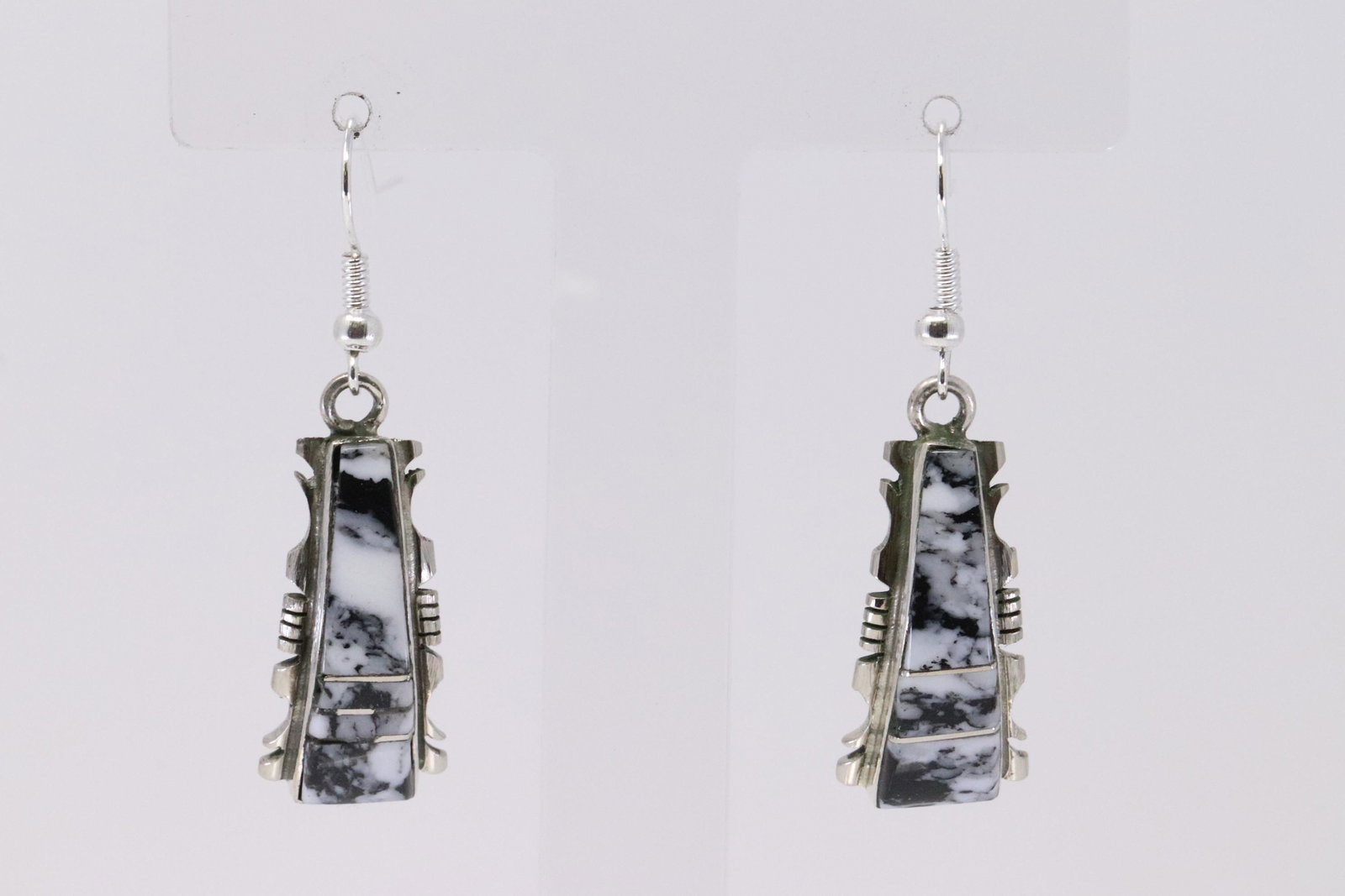 Native American Navajo Handmade Sterling Silver: This is a Native American Navajo Handmade Sterling Silver Synthetic White Buffalo Inaly Dangle Earrings by Steve Francisco.