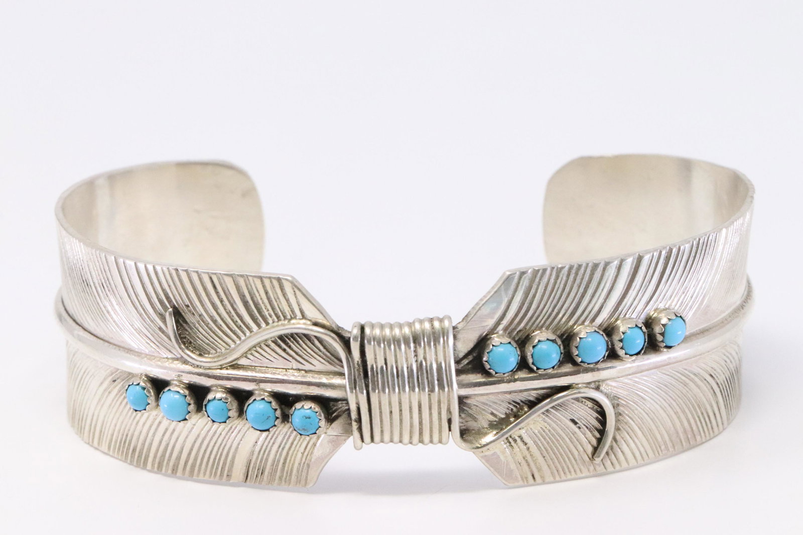 Native American Navajo Handmade Sterling Silver: This is a Native American Navajo Handmade Sterling Silver Turquoise Feather Bracelet by Byron Begay.
