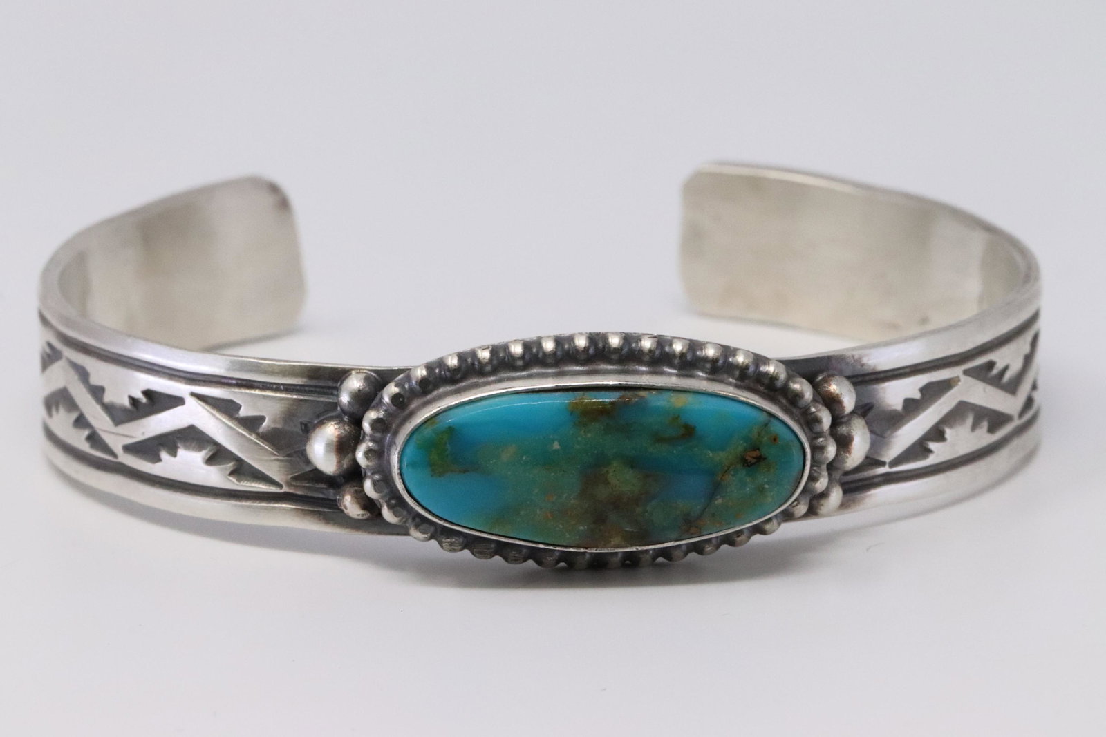 Native American Navajo Handmade Sterling Silver: This is a Native American Navajo Handmade Sterling Silver Turquoise Bracelet by Rick Enriquez.