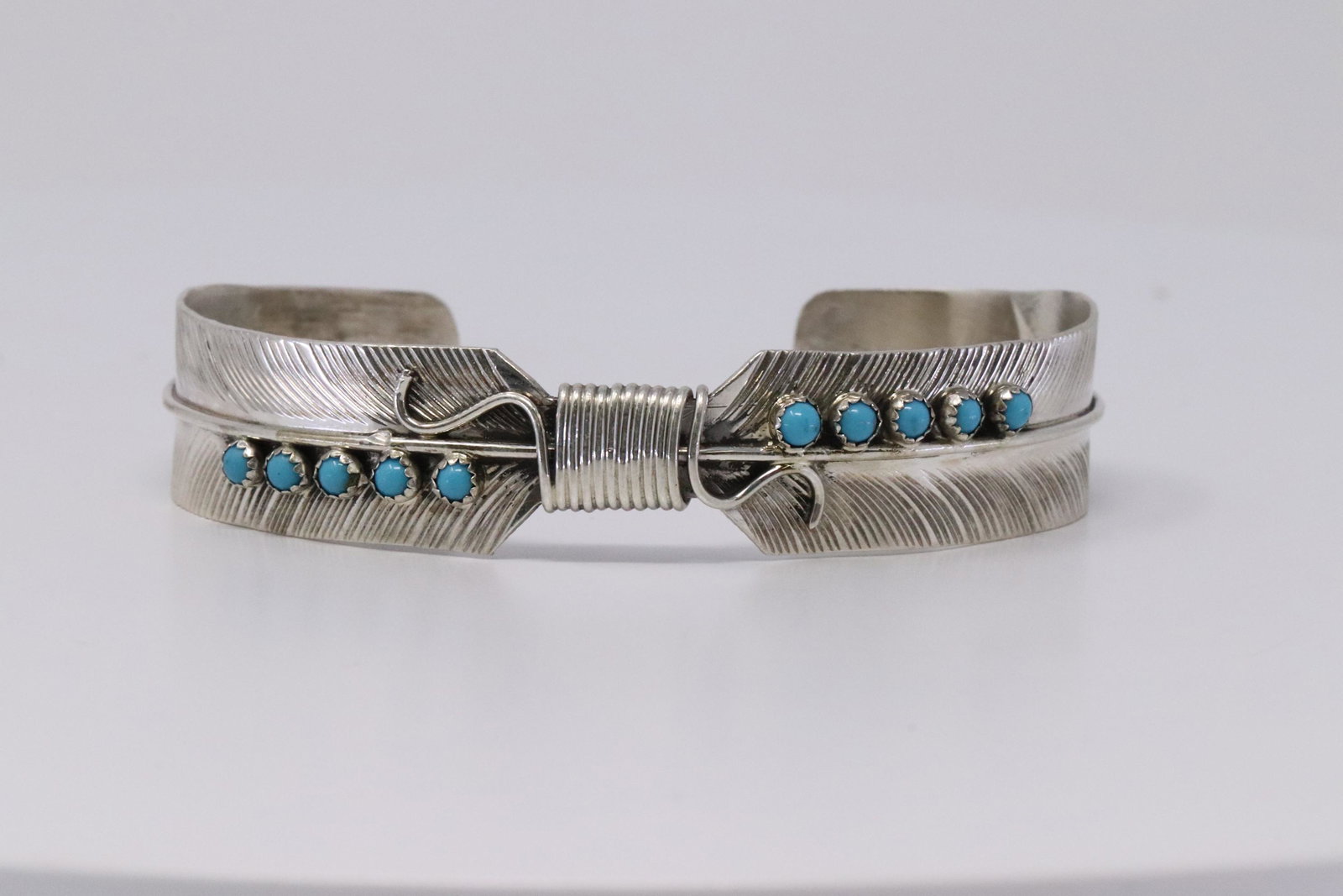 Native American Navajo Handmade Sterling Silver: This is a Native American Navajo Handmade Sterling Silver Turquoise Feather Bracelet by Byron Begay. REF: A.B