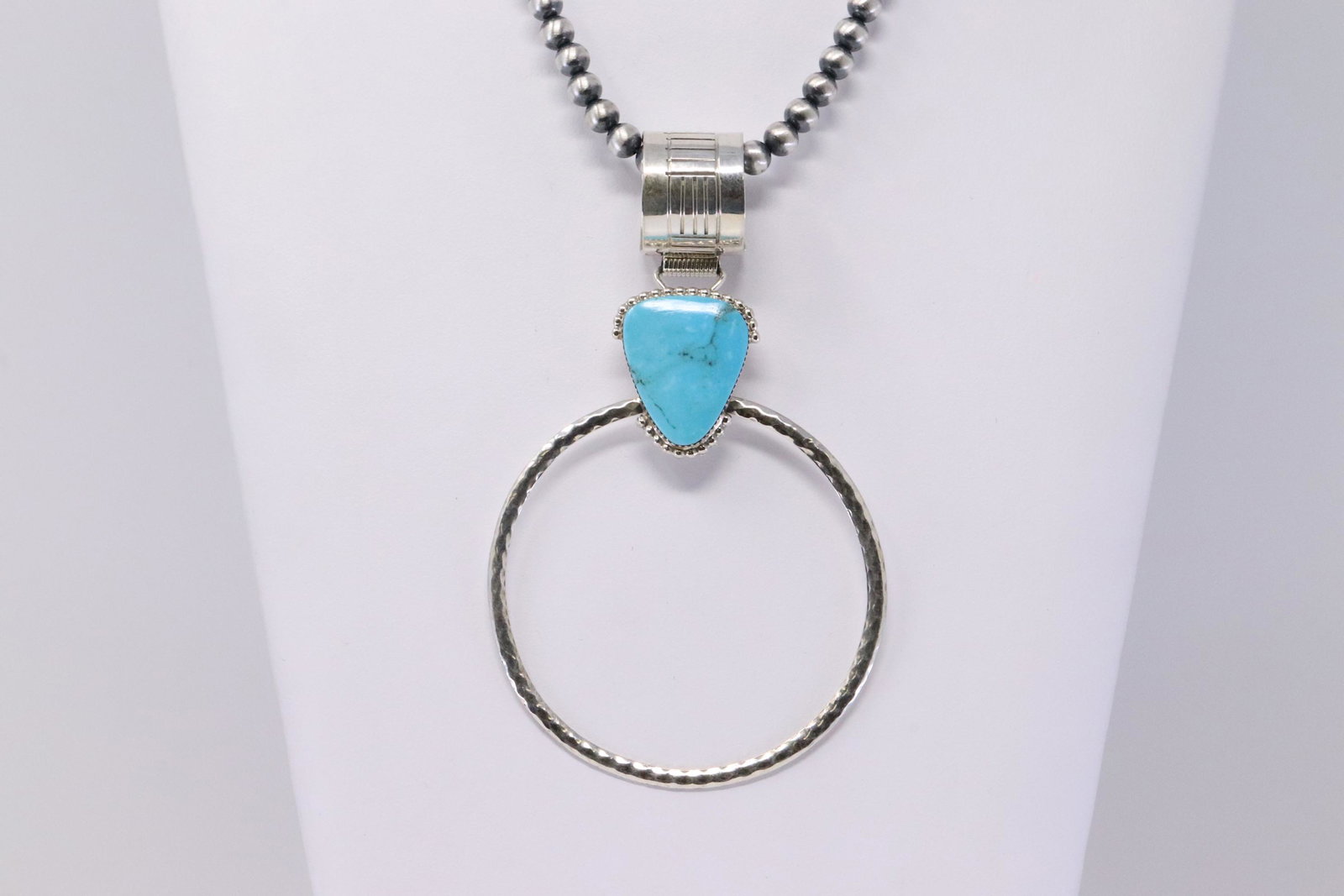 Native American Navajo Handmade Sterling Silver Kingman: This is a Native American Navajo Handmade Sterling Silver Kingman Turquoise Pendant with Beaded Pearl Necklace by Greg Yazzie. Necklace Length is 18.00in.
