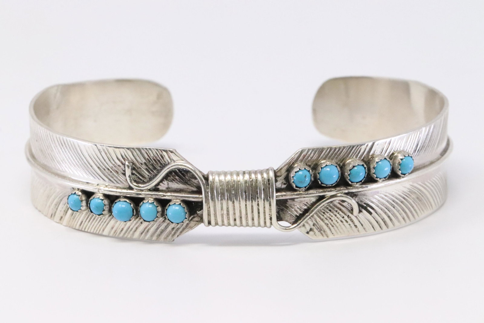 Native American Navajo Handmade Sterling Silver: This is a Native American Navajo Handmade Sterling Silver Turquoise Feather Bracelet by Byron Begay.