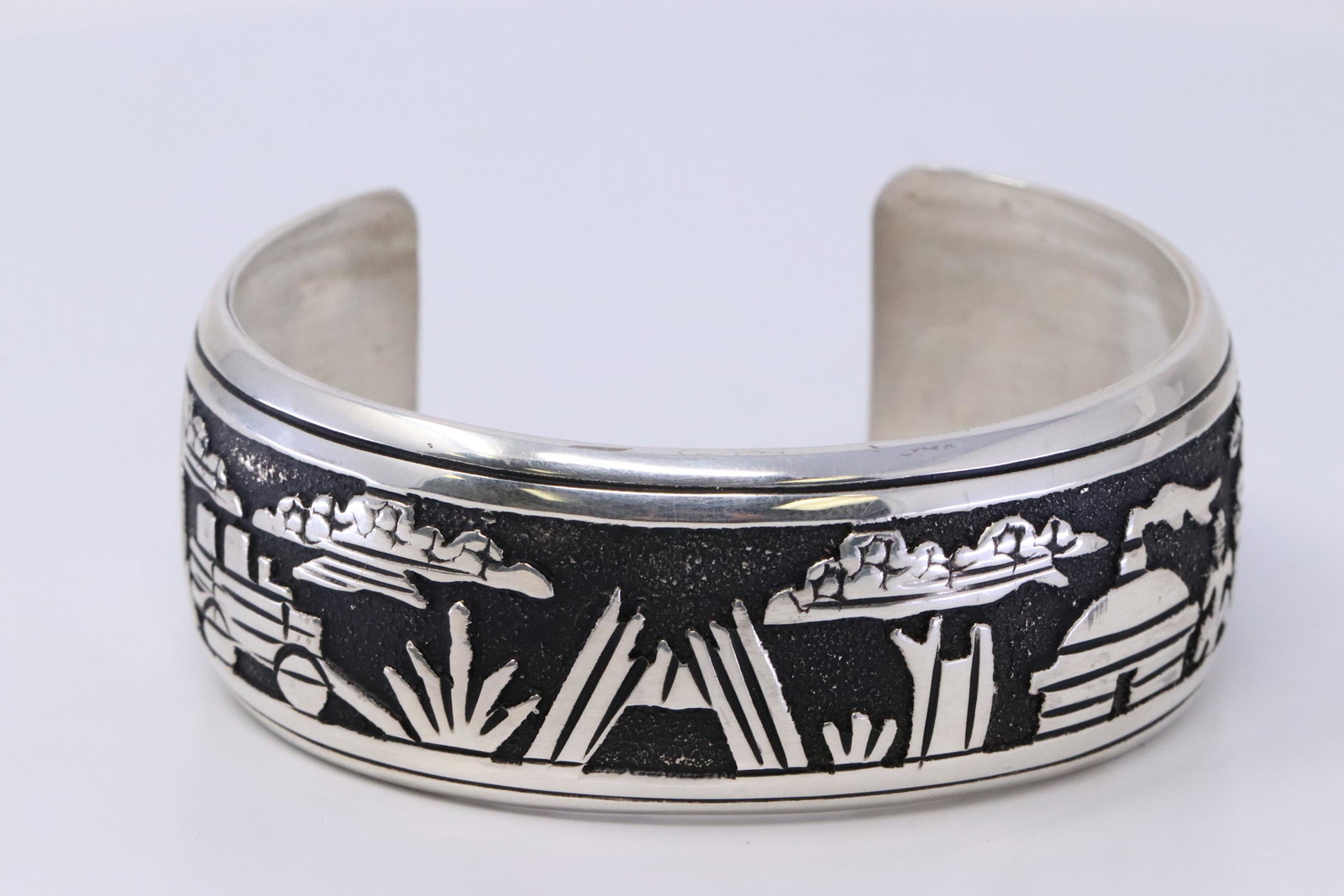 Native American Navajo Handmade Sterling Silver: This is a Native American Navajo Handmade Sterling Silver Storyteller Bracelet By T&R Singer. Bracelet size is 6.00.