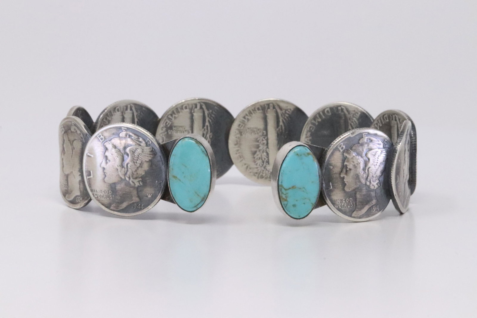 Native America Navajo Handmade Sterling Silver Liberty: This is a Native America Navajo Handmade Sterling Silver Liberty Dime Bracelet with Turquoise By James Mccabe.