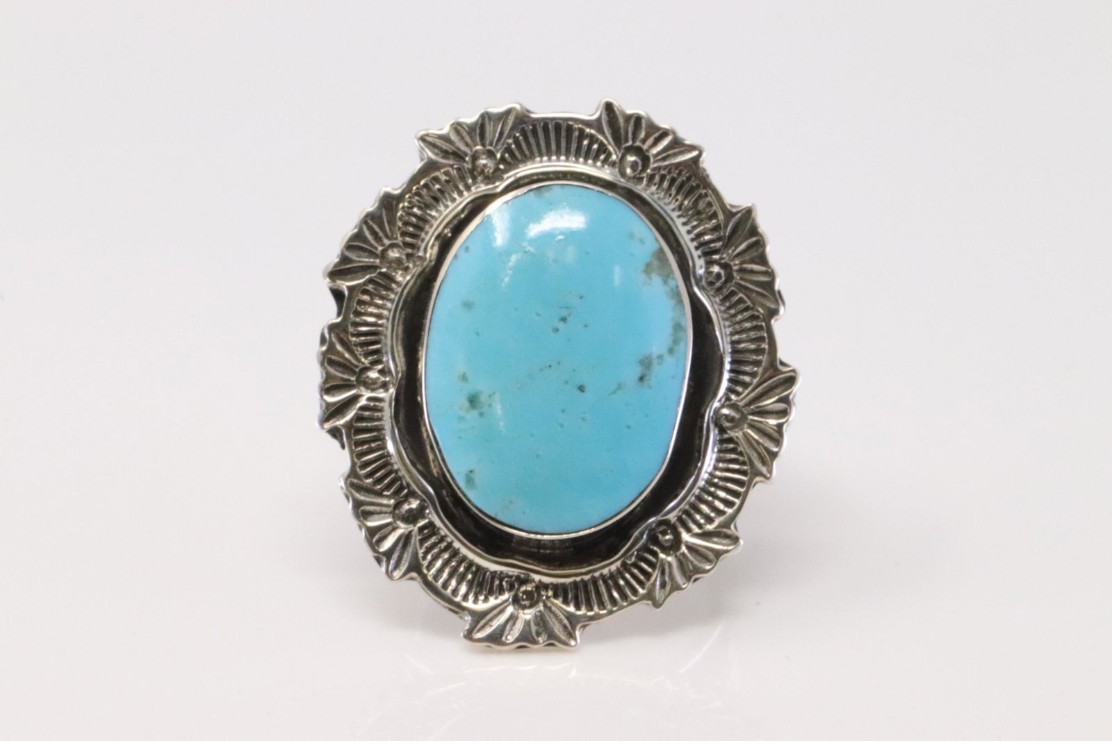 Native America Handmade Navajo Sterling Silver: This is a Native America Handmade Navajo Sterling Silver Turquoise Stamped Ring By Daniel Benally. Ring size: 5.75.