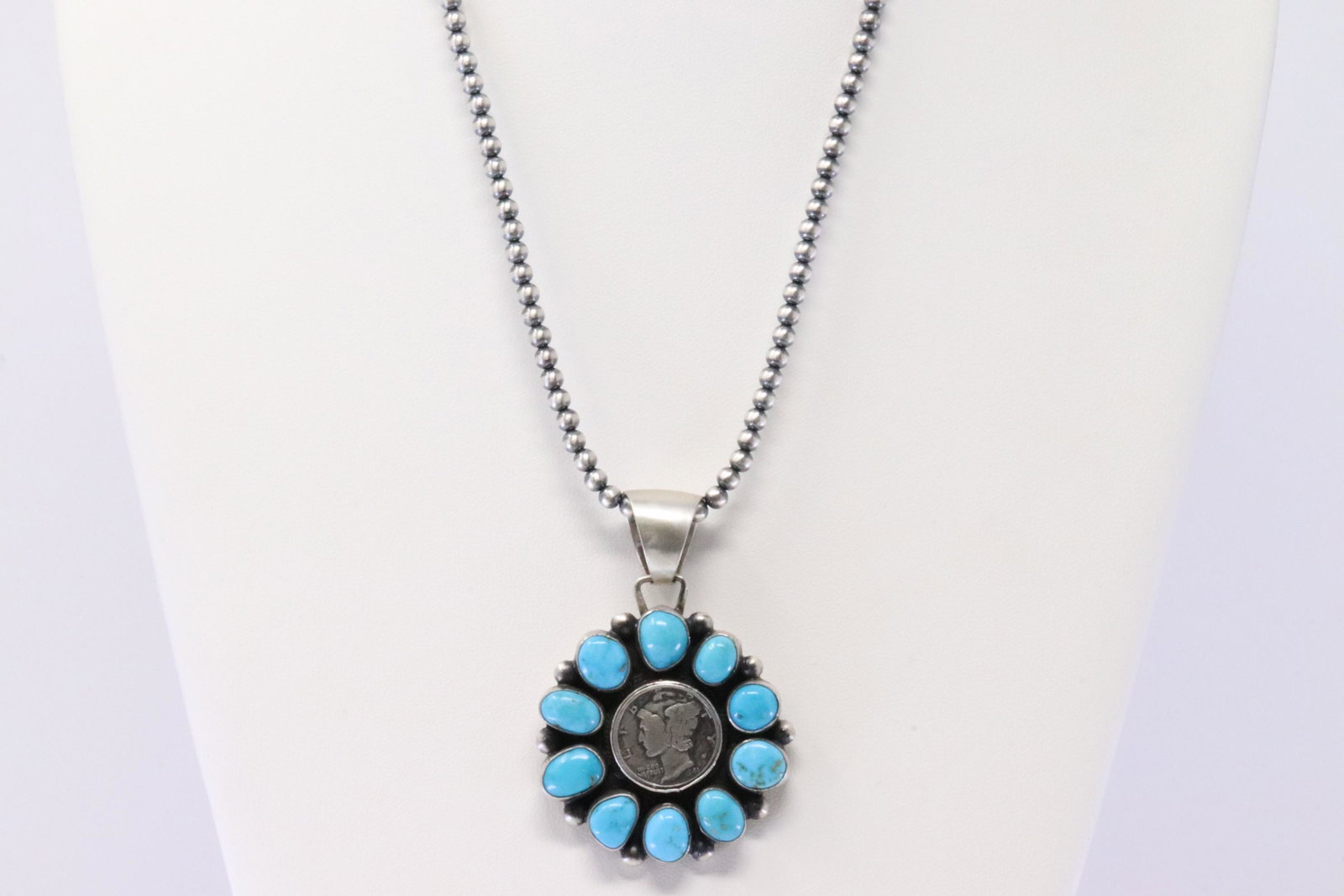 Native American Navajo Handmade Sterling Silver: This is a Native American Navajo Handmade Sterling Silver Turquoise Dime Pendant & Necklace By Bobby Johnson. Necklace length: 18.00"