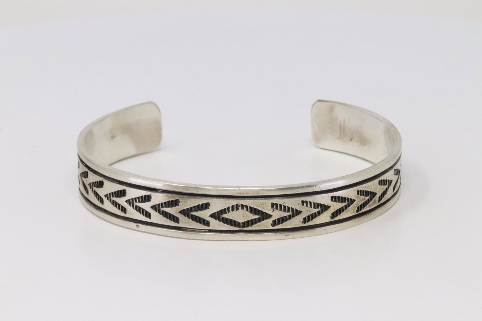 Native America Navajo Handmade Sterling Silver Bracelet: This is a Native America Navajo Handmade Sterling Silver Bracelet By Rick Enriquez.