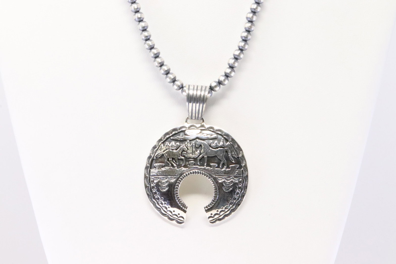 Native American Navajo Handmade Sterling Silver Horse: This is a Native American Navajo Handmade Sterling Silver Horse Pendant & Pearl Beaded Necklace By June Delgarito. Necklace length: 18.00"
