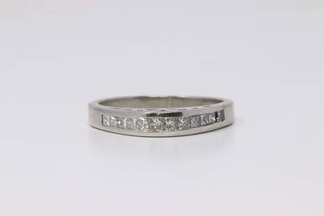 Platinum Diamond Band Ring.: Ladies Platinum Diamond Band Ring. 12 Princess Cut Diamonds, appx 0.50cttw. VS-SI clarity. Ring size: 7.25. Total weight: 5.59 Grams.