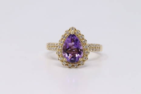 14Kt Yellow Gold Amethyst Diamond Ring.: 14Kt Ladies Yellow Gold Amethyst Diamond Ring. Ring Center stone is Purple Amethyst Stone in the center with Diamonds. Diamonds weight: 0.35cttw. Ring size: 7.00. Total weight: 3.55 Grams. TX-L7B4