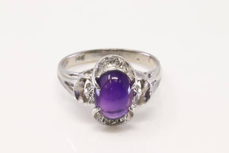 14Kt White Gold Vintage Cabochon Amethyst Ring.: Ladies 14Kt White Gold Vintage Cabochon Amethyst Ring. Ring has ona purple Cabochon Amethyst on the center. Ring size: 6.00. Total weight: 3.56 Grams.