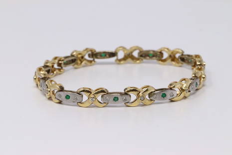 14Kt Two Tone Gold Diamond & Emerald Bracelet.: 14Kt Ladies Yellow & White Gold Diamond Bracelet. Bracelet has 11 Emerald & 33 Diamonds round. Length Bracelet: 7.00 inch. Total weight: 14.63 Grams. AY-7N41X