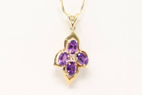 14Kt Yellow Gold Amethyst / Diamond Pendant.: Ladies 14Kt Yellow Gold Amethyst / Diamond Pendant. Pendant has 4 Purple Amethyst & one diamond on the center with a 14k Necklace. Necklace length: 26.00" Total weight: 3.96 Grams.