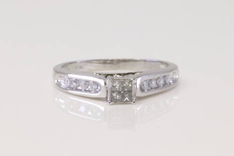 White Gold Diamond Ring.: Ladies White Gold Diamond Ring. Ring has 12 Diamonds. Ring size: 6.50. Total weight: 2.60 Grams.