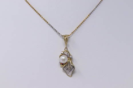 14K Pearl and Diamond Ladies Pendant with 22in 14K chain: Ladies pearl and diamond pendant tested 14k gold, comes with two tone 22in Chain stamped Italy 14k total weight is 5.1g