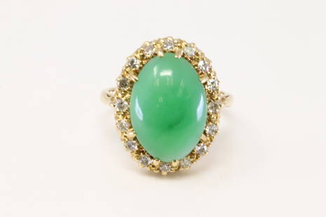 18Kt Yellow Gold Jade / Diamond Ring.: Ladies 18Kt Yellow Gold Jade / Diamond Ring. Ring has one Green Jade Stone on the center with 16 round Diamonds. Ring size: 6.25. Total weight: 6.30 Grams.