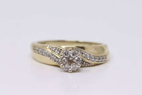 18Kt Yellow Gold Sapphire Diamond Ring.: Ladies 18Kt Yellow Gold Sapphire Diamond Ring. Ring has One Sapphire On the Center With Round Diamonds. Ring size:b7.75. Total weight: 4.60 Grams.