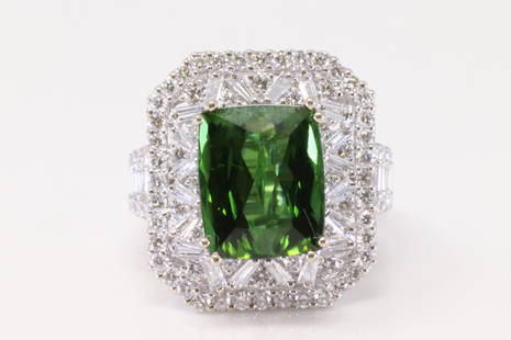 18Kt White Gold Green Tormaline / Diamond Ring.: Ladies 18Kt White Gold Green Tormaline / Diamond Ring. Ring has one Green Tourmaline Stone on the center Size 11.75mmx9.57mm with 102 round Diamonds. Diamonds weight approx: 3.50ctw. Ring size: 6.50.