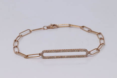 14KT Rose Gold Clip Diamond Bracelet: A 14Kt Rose Gold Diamond Clip bracelet. Bracelet has round diamonds set on the center. Total diamonds weight 0.25ctw. Length: 6.50in. Total weight: 2.24 grams. RFI-39FKK3