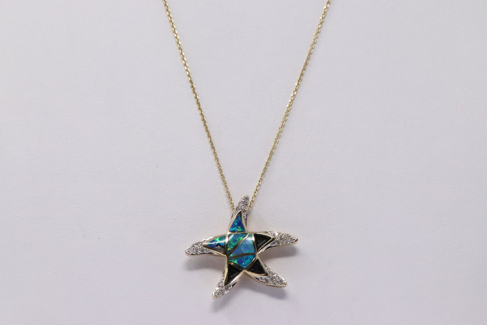 14Kt Yellow Gold Opal Diamond Star Fish Pendant. (1 of 3)