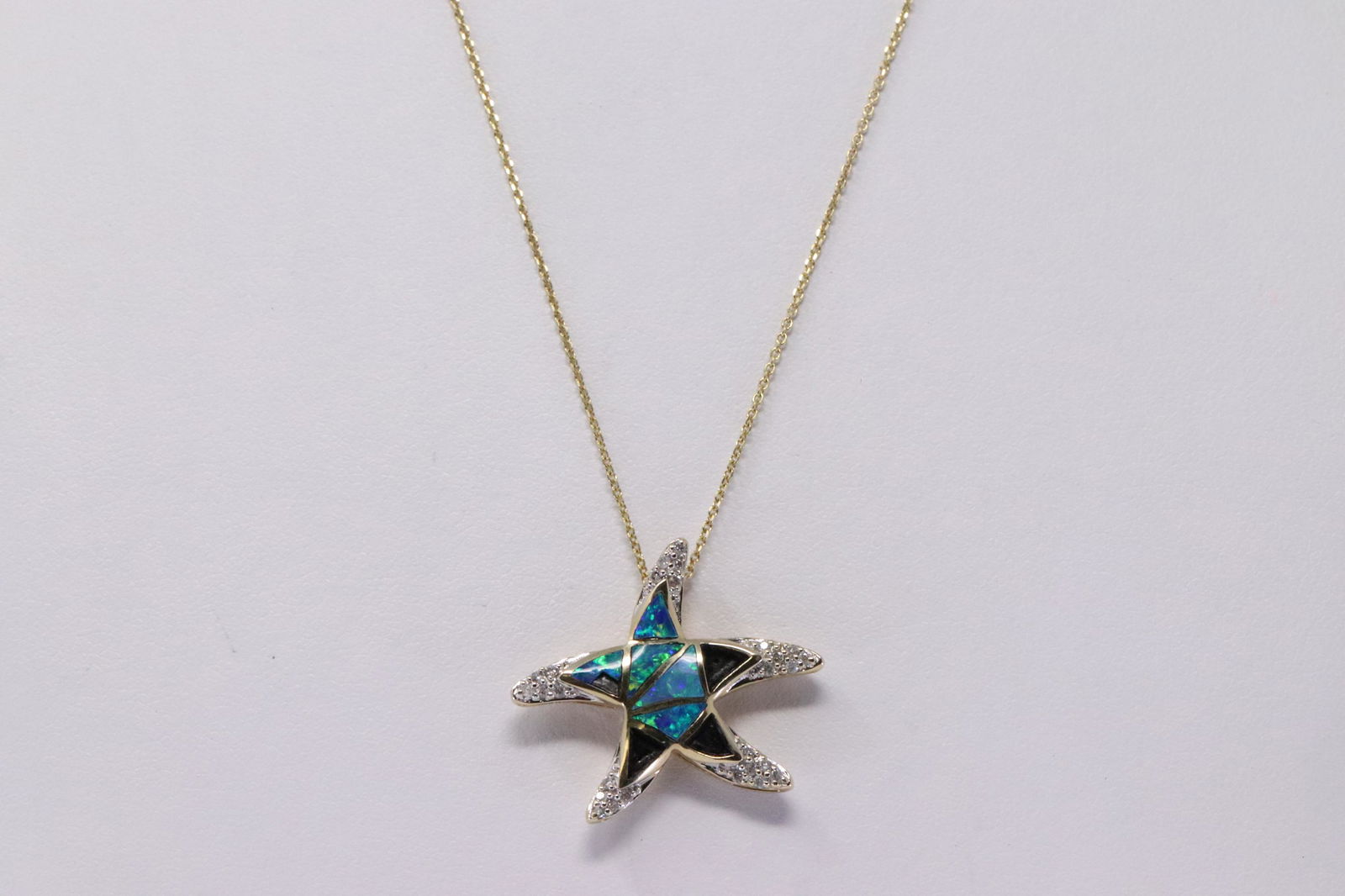14Kt Yellow Gold Opal Diamond Star Fish Pendant. (1 of 3)