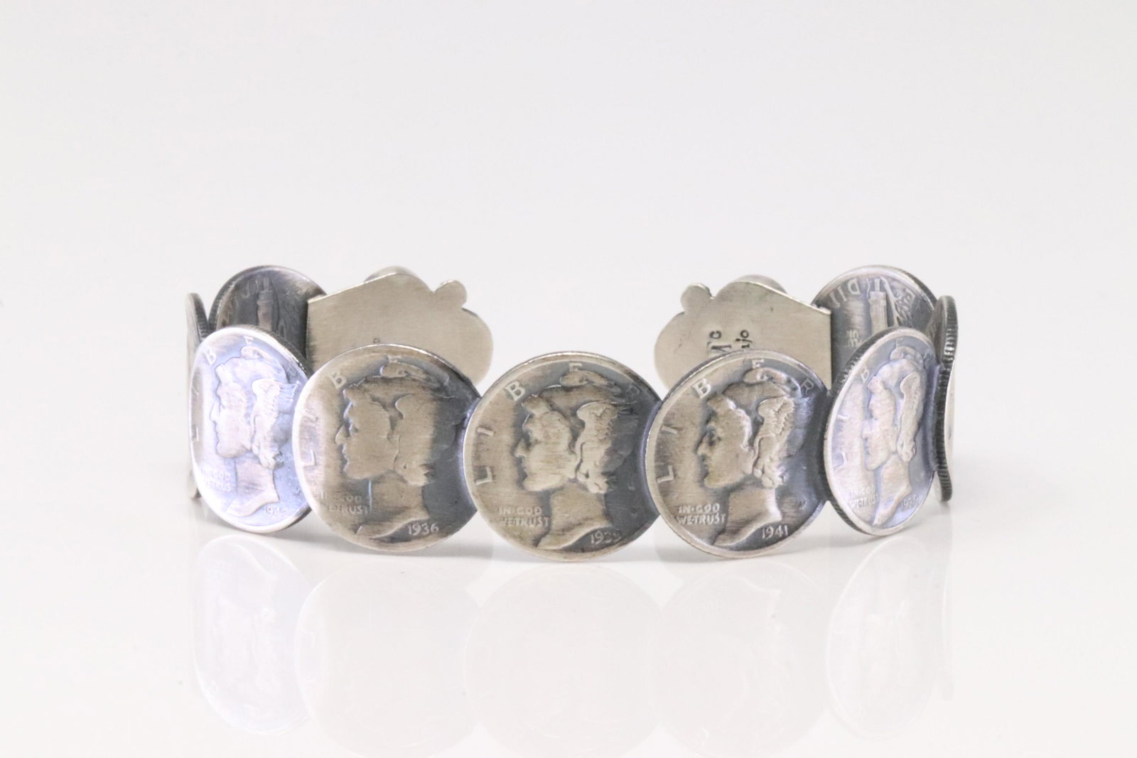 Native America Navajo Handmade Sterling Silver Turquoise Liberty Dime Bracelet By James McCabe.: This is a Native America Navajo Handmade Sterling Silver Turquoise Liberty Dime Bracelet By James McCabe.