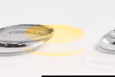 18Kt Yellow Gold / Platinum Tiffany & Co Ring.: 18Kt Yellow Gold / Platinum Tiffany & Co Ring. Ring has 2 Tone Filigree Wedding Band. Ring size: 10.00. Total weight: 10.76 Grams.