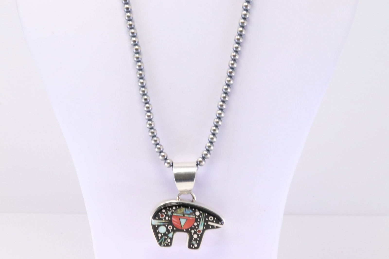 Native America Navajo Sterling Silver Night Sky Inlay Bear Pendant By Matthew Jack. With Pearl: This is a Native America Navajo Sterling Silver Night Sky Inlay Bear Pendant By Matthew Jack. With Pearl Beaded Sterling Silver Machine Made Necklace. Necklace length: 18.00"