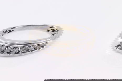 Diamond Wedding Ring 10Kt.: 10Kt White Gold Diamond Wedding Ring. Ring has 7 round Diamonds. Diamonds weight: appro 0.50ctw. Ring size: 10.50. Total weight: 3.30 Grams.