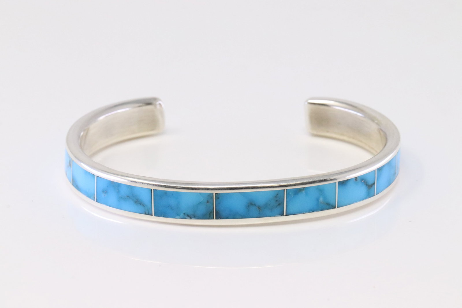 Native America Zuni Sterling Silver Turquoise Inlay Bracelet By Larry Loretto.: This is a Native America Zuni Sterling Silver Turquoise Inlay Bracelet By Larry Loretto.