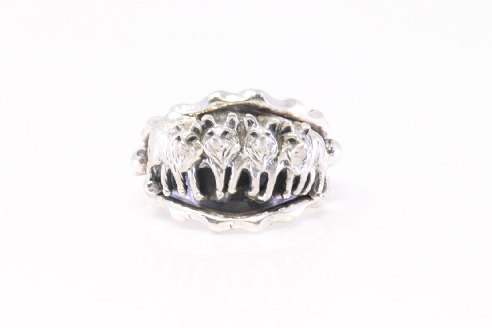 Native America Navajo Sterling Silver Wolf Pack Ring By Genevieve Francisco.: This is a Native America Navajo Sterling Silver Wolf Pack Ring By Genevieve Francisco. Ring size: 10.75.