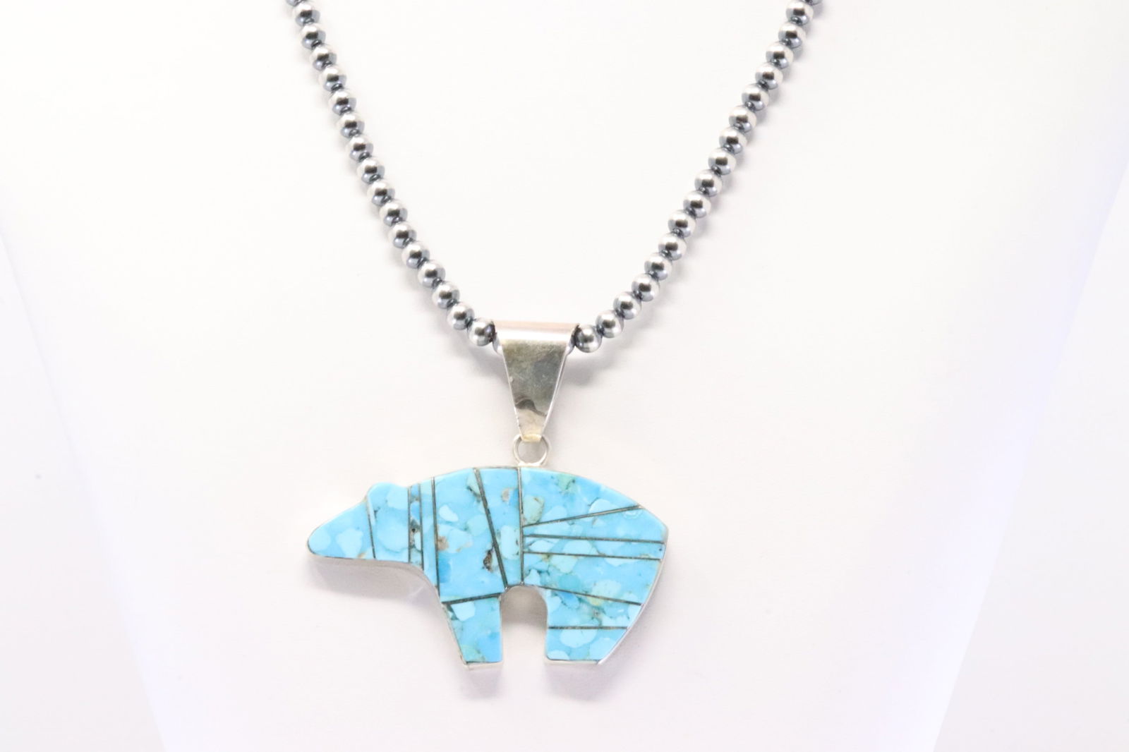 Native America Navajo Sterling Silver Turquoise Inlay Bear Pendant By S.F. With Sterling Silver: Native America Navajo Sterling Silver Turquoise Inlay Bear Pendant By S.F. With Sterling Silver Machine Made Necklace. Necklace length: 18.00"