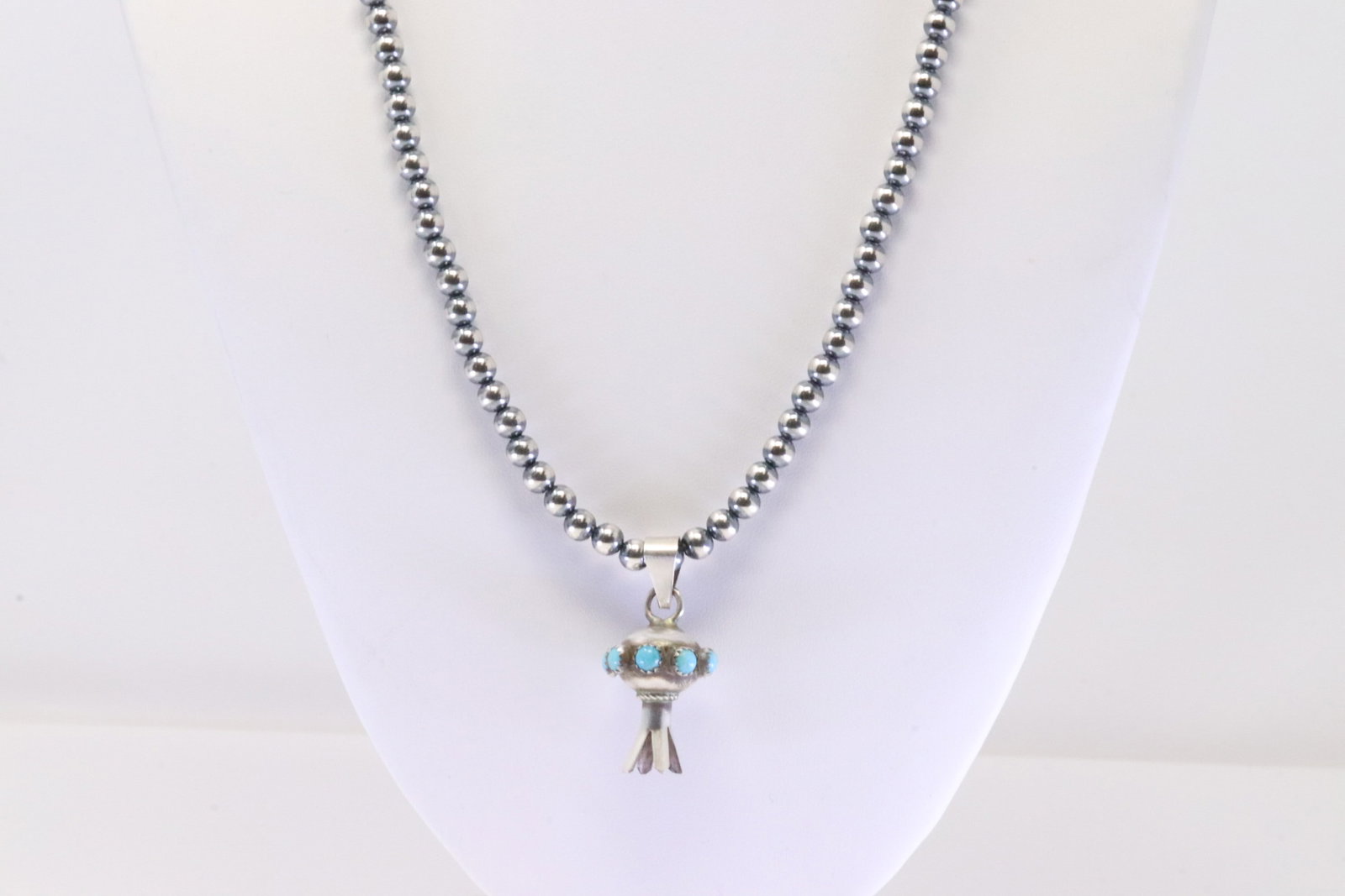 Native America Navajo Sterling Silver Turquoise Squash Blosoom Pendant By Monica Smith. With Pearl: This is a Native America Navajo Sterling Silver Turquoise Squash Blosoom Pendant By Monica Smith. With Pearl Beaded Sterling Silver Machine Made. Necklace length: 20.00"
