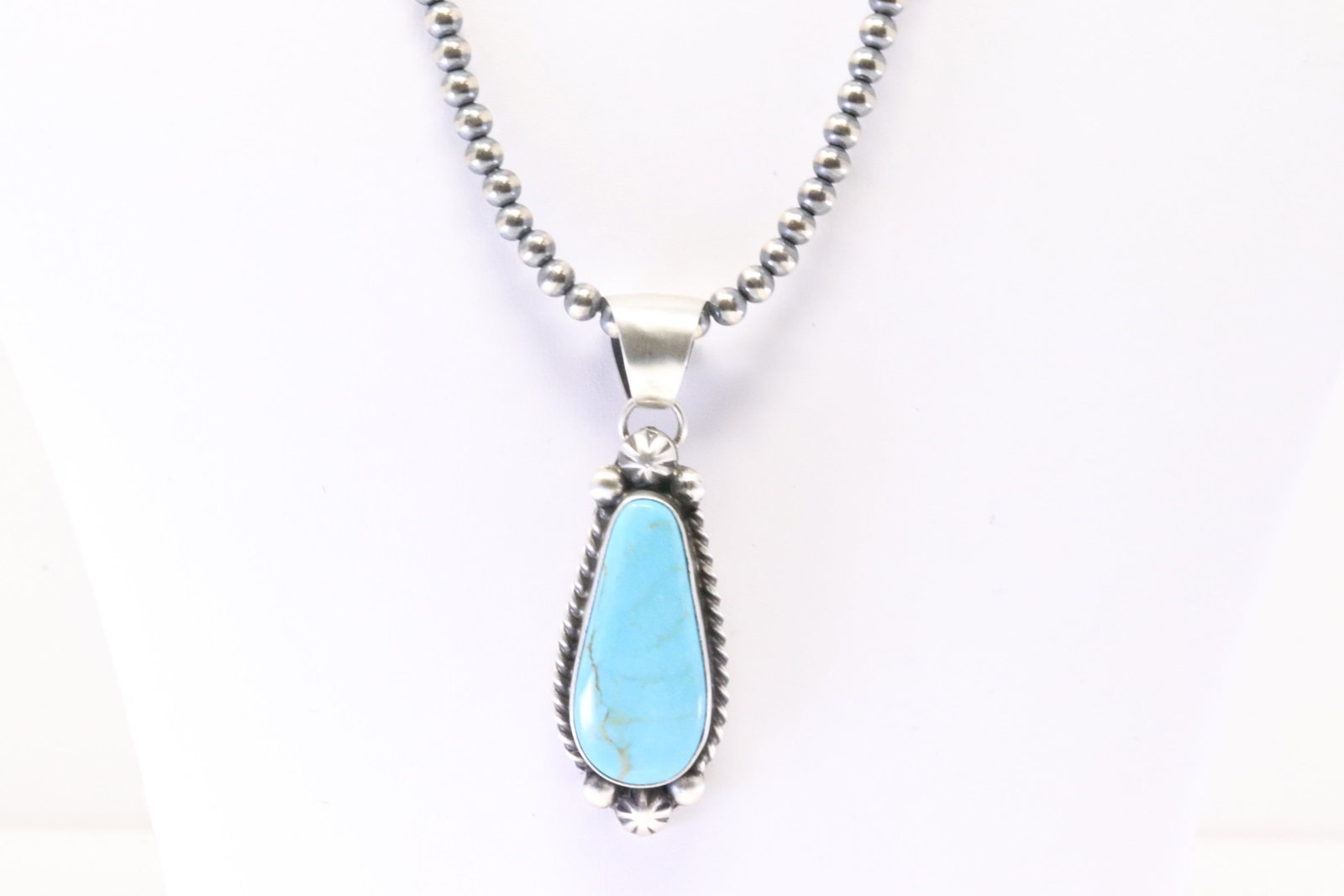 Native America Navajo Sterling Silver Kingman Turquoise Pendant By Augustine Largo. With Pearl: This is a Native America Navajo Sterling Silver Kingman Turquoise Pendant By Augustine Largo. With Pearl Beaded Sterling Silver Machine Made Necklace. Necklace length: 18.00"