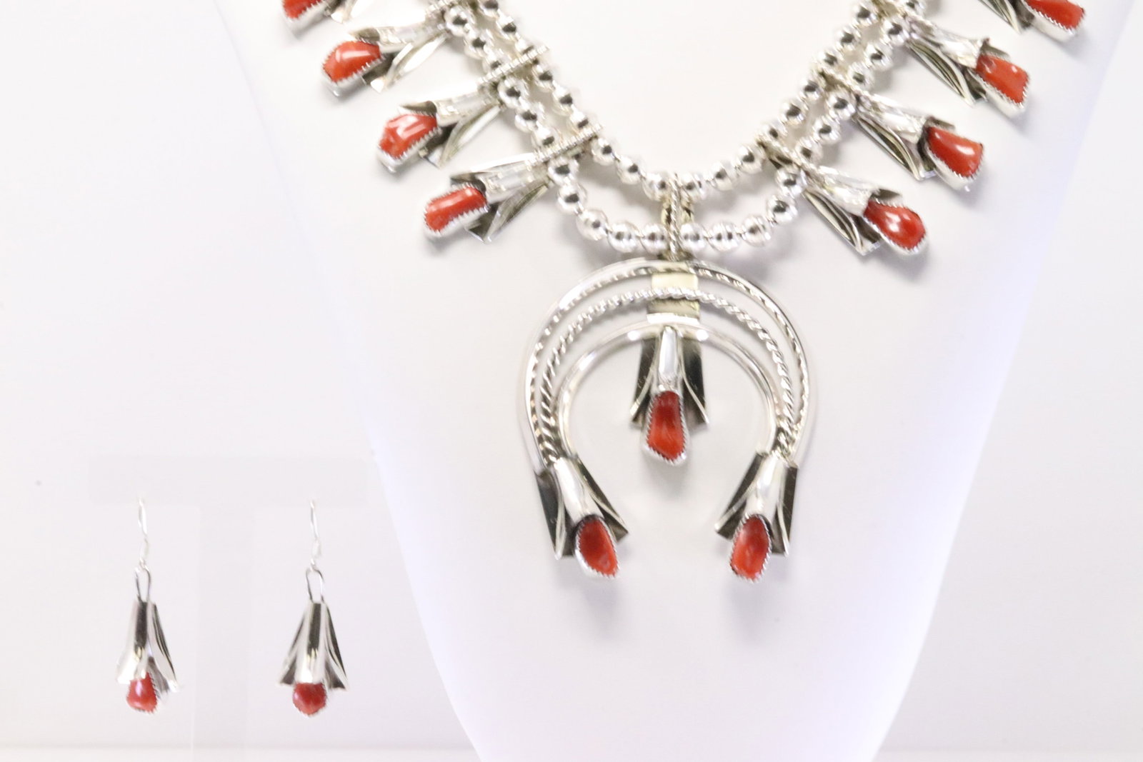 Native America Navajo Sterling Silver Coral Squash Blossom Necklace & Earring's Set By L.Y.: This is a Native America Navajo Sterling Silver Coral Squash Blossom Necklace & Earring's Set By L.Y. Necklace length: 24.00" Total weight: 136.10 Grams.