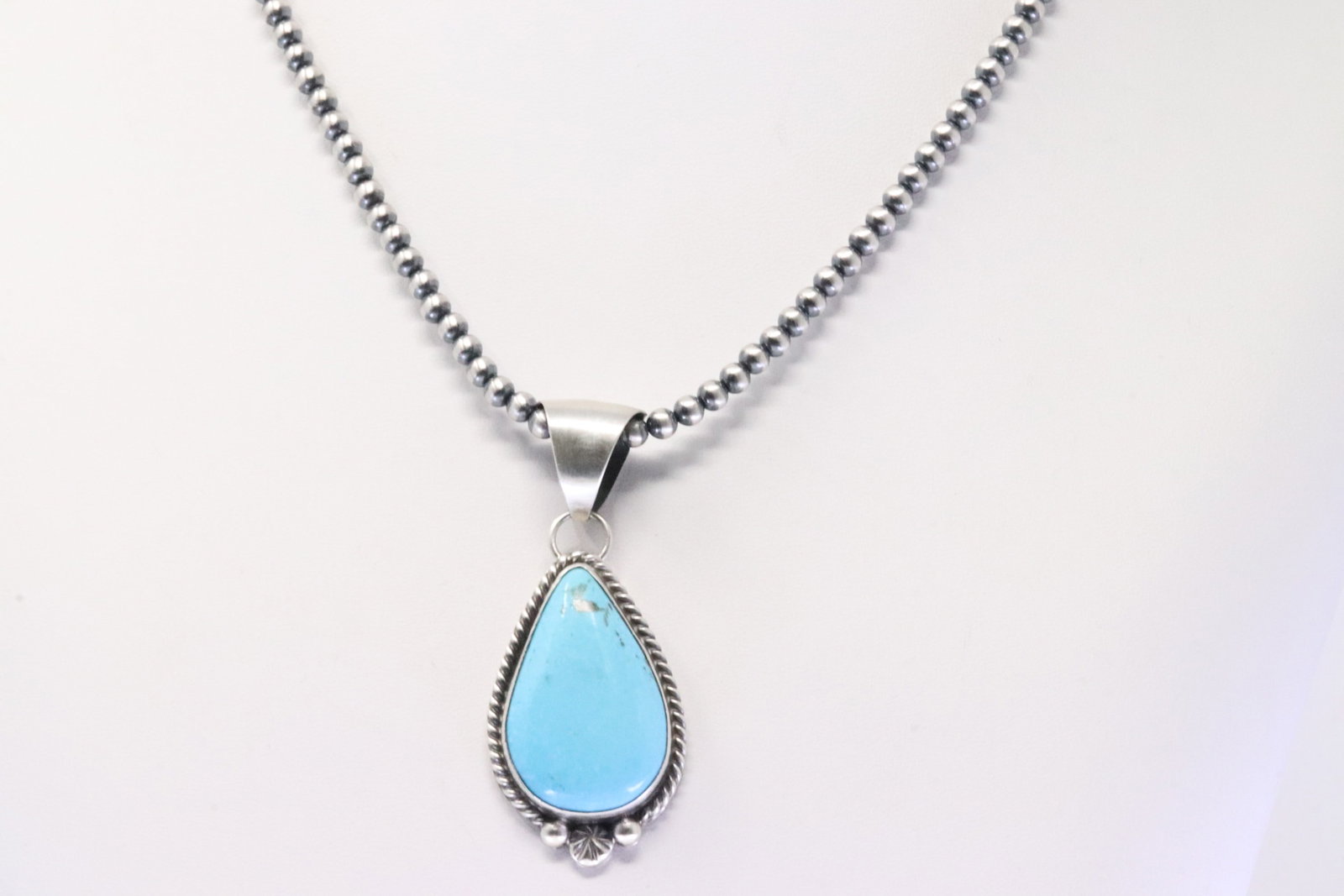 Native America Navajo Sterling Silver Kingman Turquoise Pendant By Alfred Martinez. With Pearl: This is a Native America Navajo Sterling Silver Kingman Turquoise Pendant By Alfred Martinez. With Pearl Beaded Sterling Silver Machine Made Necklace. Necklace length: 18.00"
