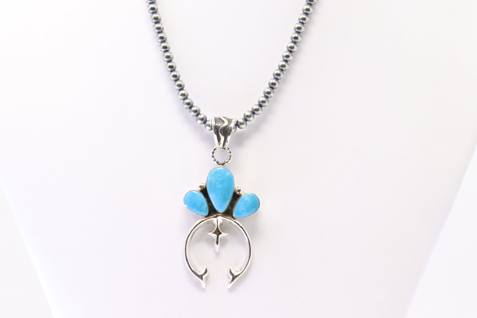 Native America Navajo Sterling Silver Turquoise Naja Pendant By Irvin Tsosie. With Pearl Beaded: This is a Native America Navajo Sterling Silver Turquoise Naja Pendant By Irvin Tsosie. With Pearl Beaded Sterling Silver Machine Made Necklace. Necklace length: 14.00"