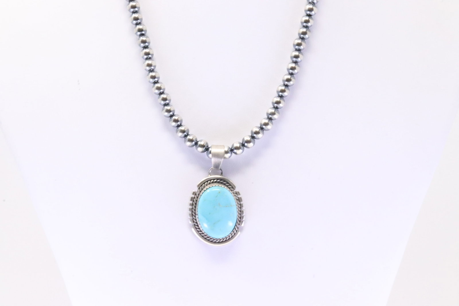 Native America Navajo Sterling Silver Kingman Turquoise Pendant By Freida Martinez. With Pearl: This is a Native America Navajo Sterling Silver Kingman Turquoise Pendant By Freida Martinez. With Pearl Beaded Sterling Silver Machine Made Necklace. Necklace length: 16.00"