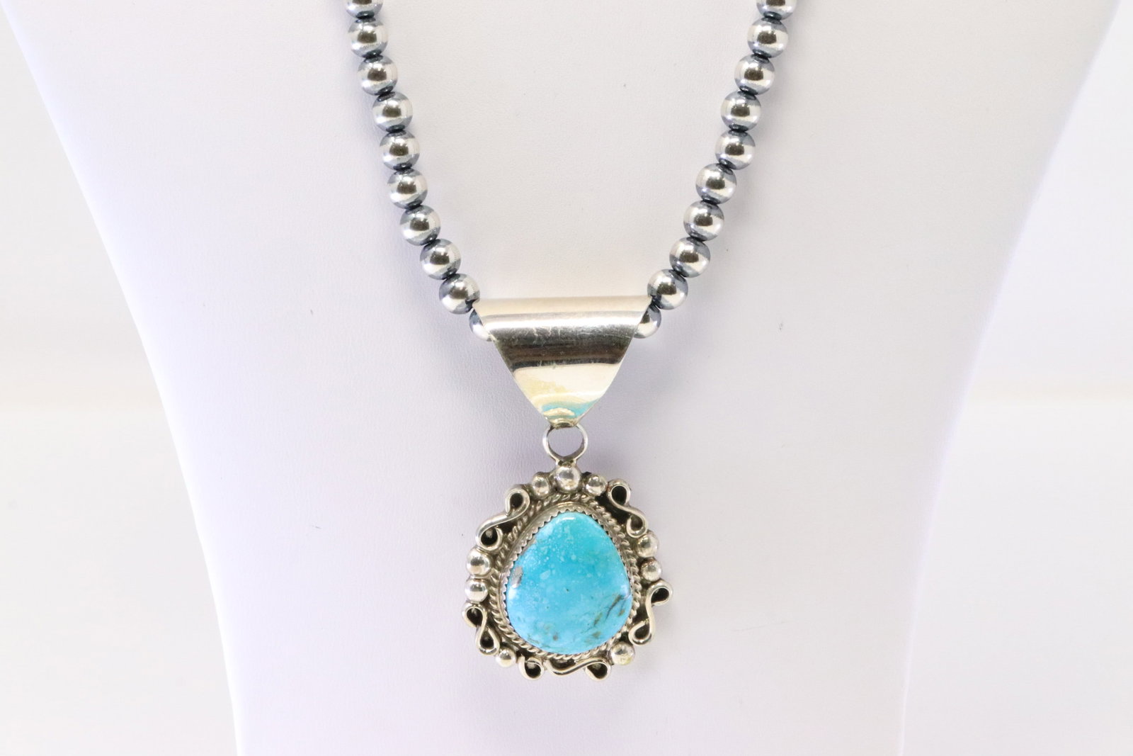 Native America Navajo Sterling Silver Turquoise Pendant By D.M. With Pearl Beaded Sterling Silver: This is a Native America Navajo Sterling Silver Turquoise Pendant By D.M. With Pearl Beaded Sterling Silver Machine Made Necklace. Necklace length: 20.00"