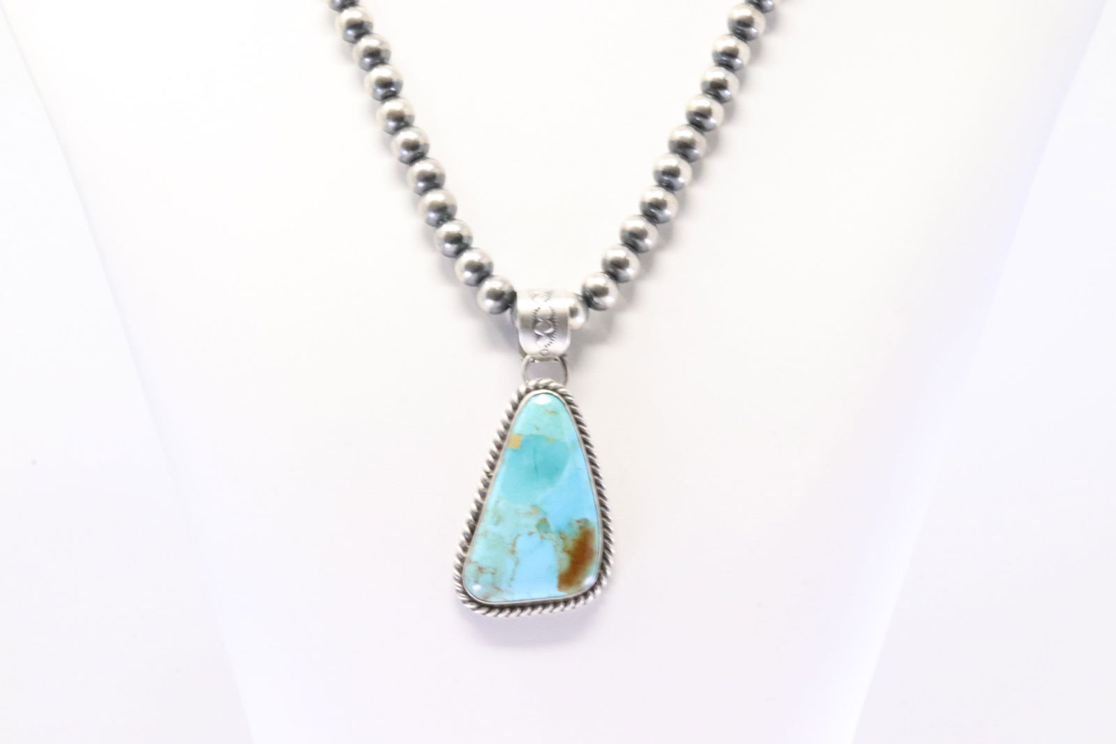Native America Navajo Sterling Silver Kingman Turquoise pendant By Augustine Largo. With Pearl: This is a Native America Navajo Sterling Silver Kingman Turquoise pendant By Augustine Largo. With Pearl Beaded Sterling Silver Machine Made Necklace. Necklace length: 18.00"