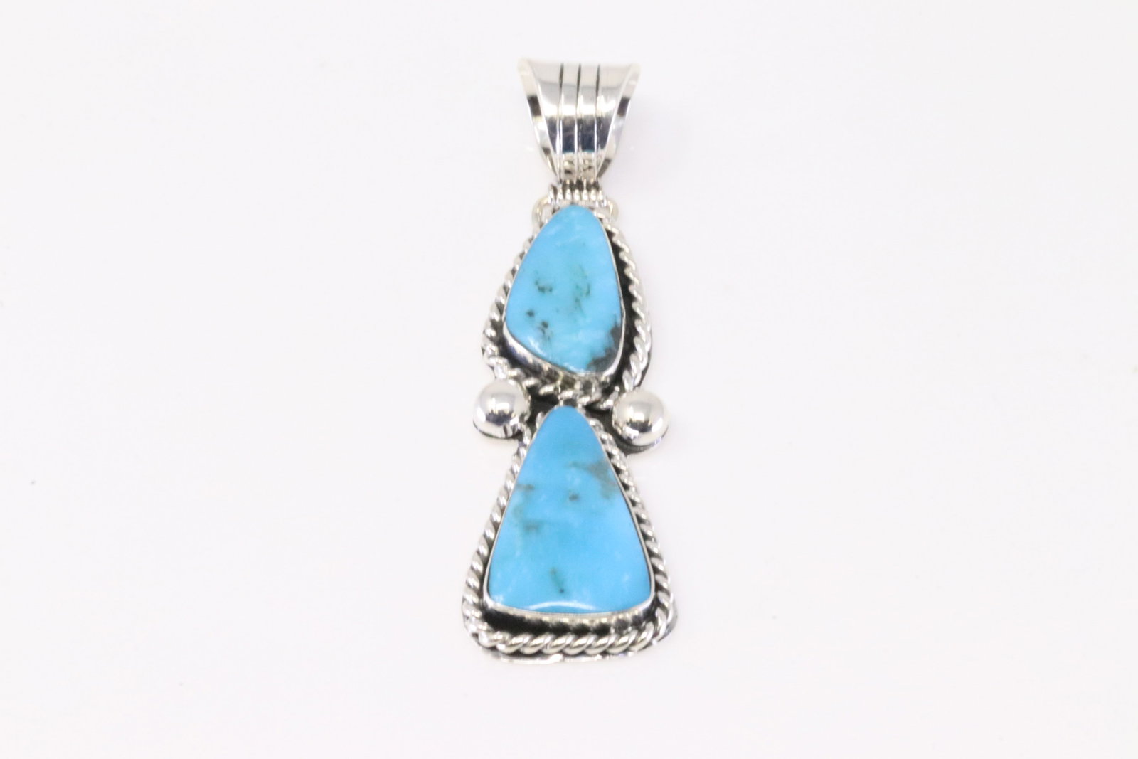 Native America Navajo Sterling Silver Turquoise Pendant By Daniel Dakai.: This is a Native America Navajo Sterling Silver Turquoise Pendant By Daniel Dakai.